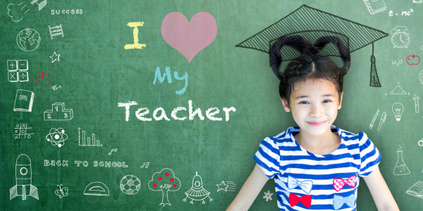 I love my teacher - cute girl in front of chalkboard