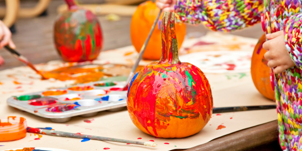 kids painting pumpkins