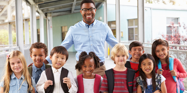 Male teacher with elementary school kids